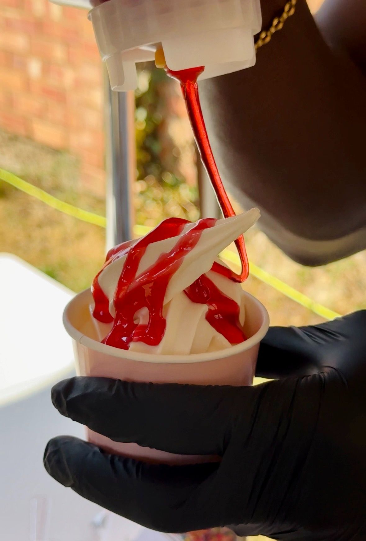 Soft serve bar with toppings and sauces at birthday